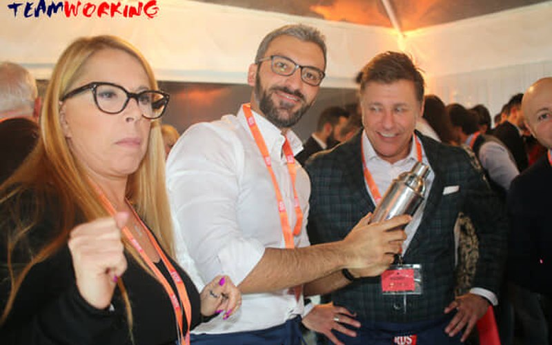 Three colleagues shaking a cocktail during the challenge