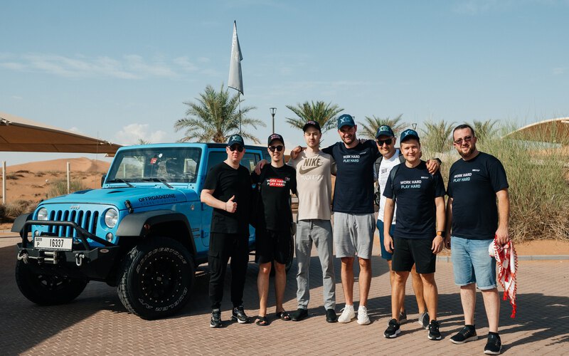 A team in the desert reading the map before setting off