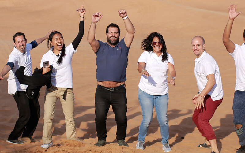 A team out in the dunes during a treasure hunt