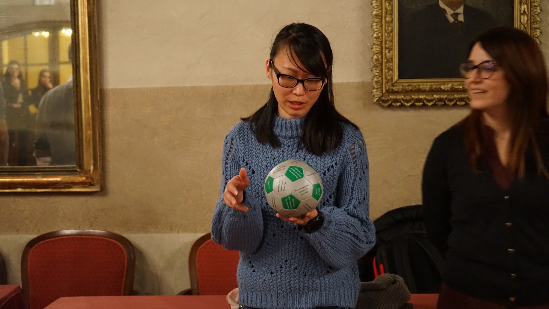 Two colleagues passing a ball during a time management exercise