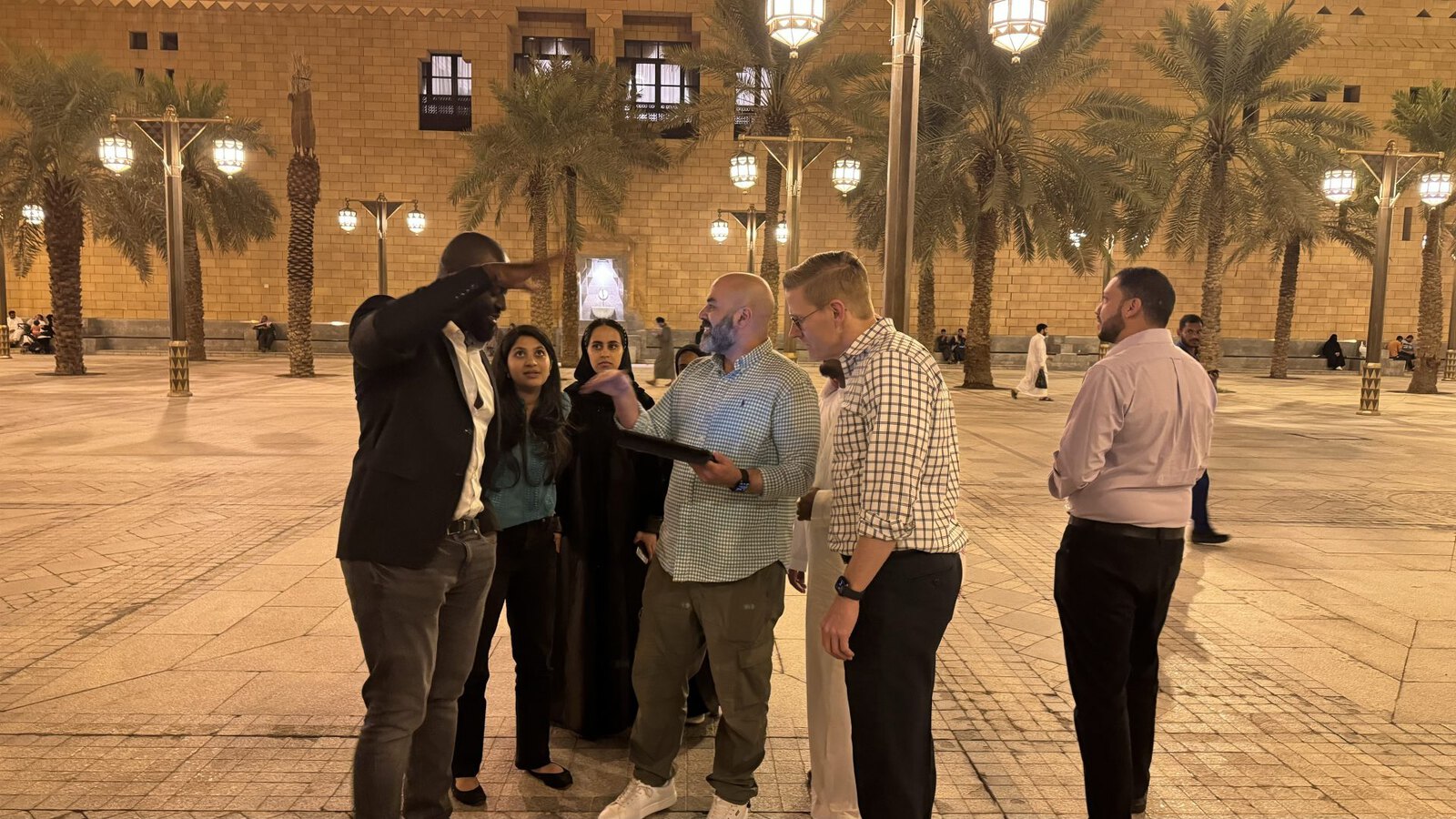 A team walking through the souk with a local guide during an urban game in Riyadh