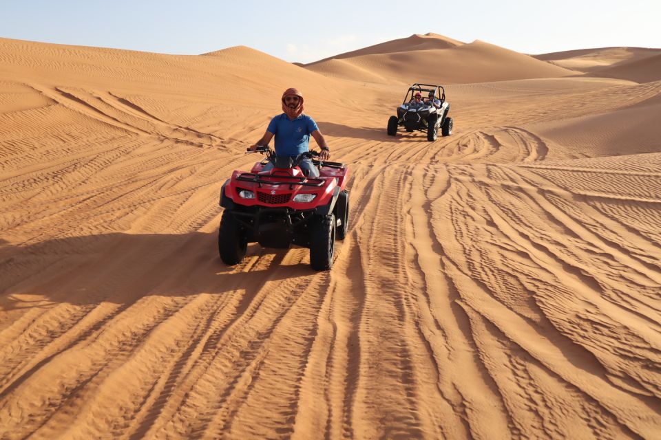Two quads crossing the dunes during a Quad Orienteering